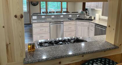 Welcoming lake house with five bedrooms and a huge deck on Tee lake in Lewiston.