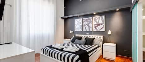 1 bedroom, desk, iron/ironing board, travel crib