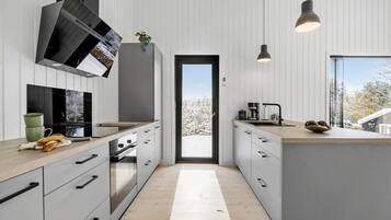 Fridge, dishwasher, coffee/tea maker, cookware/dishes/utensils