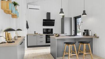 Fridge, dishwasher, coffee/tea maker, cookware/dishes/utensils