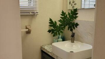 Shower, hair dryer, towels, toilet paper