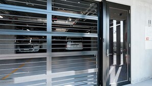 A modern parking garage with multiple levels and a metal gate. - Sunlit Sorrento Splendour in Position Perfect (Sorrento)