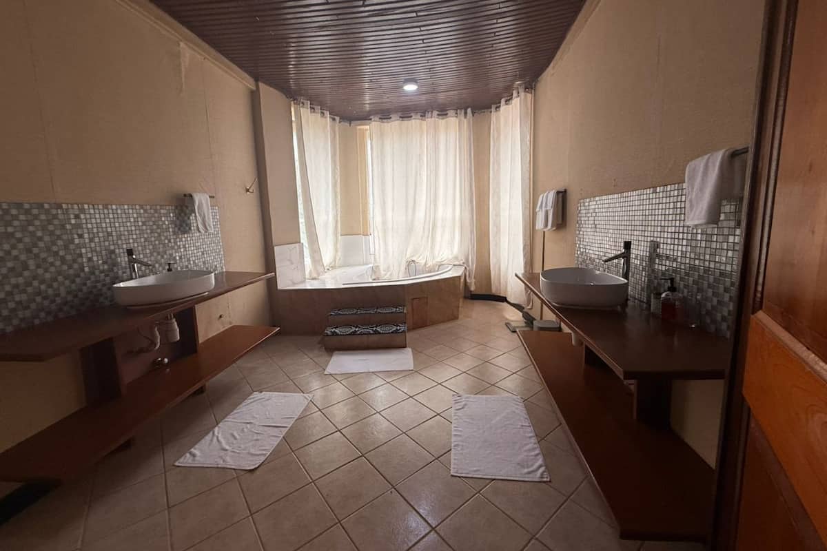 Presidential Double Room, Ocean View | Bathroom | Separate tub and shower, bathrobes, towels, soap