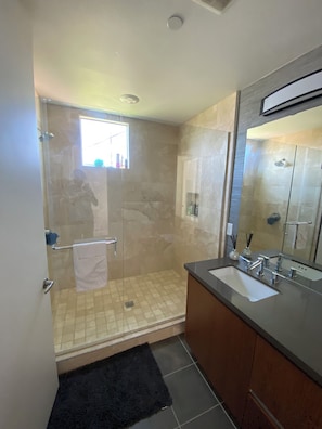 Shower, hair dryer, towels, soap