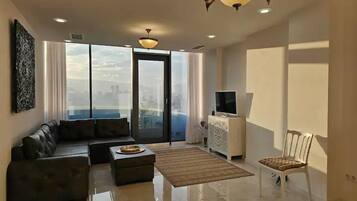 Business Apartment, City View | Living area | 42-inch LCD TV with digital channels