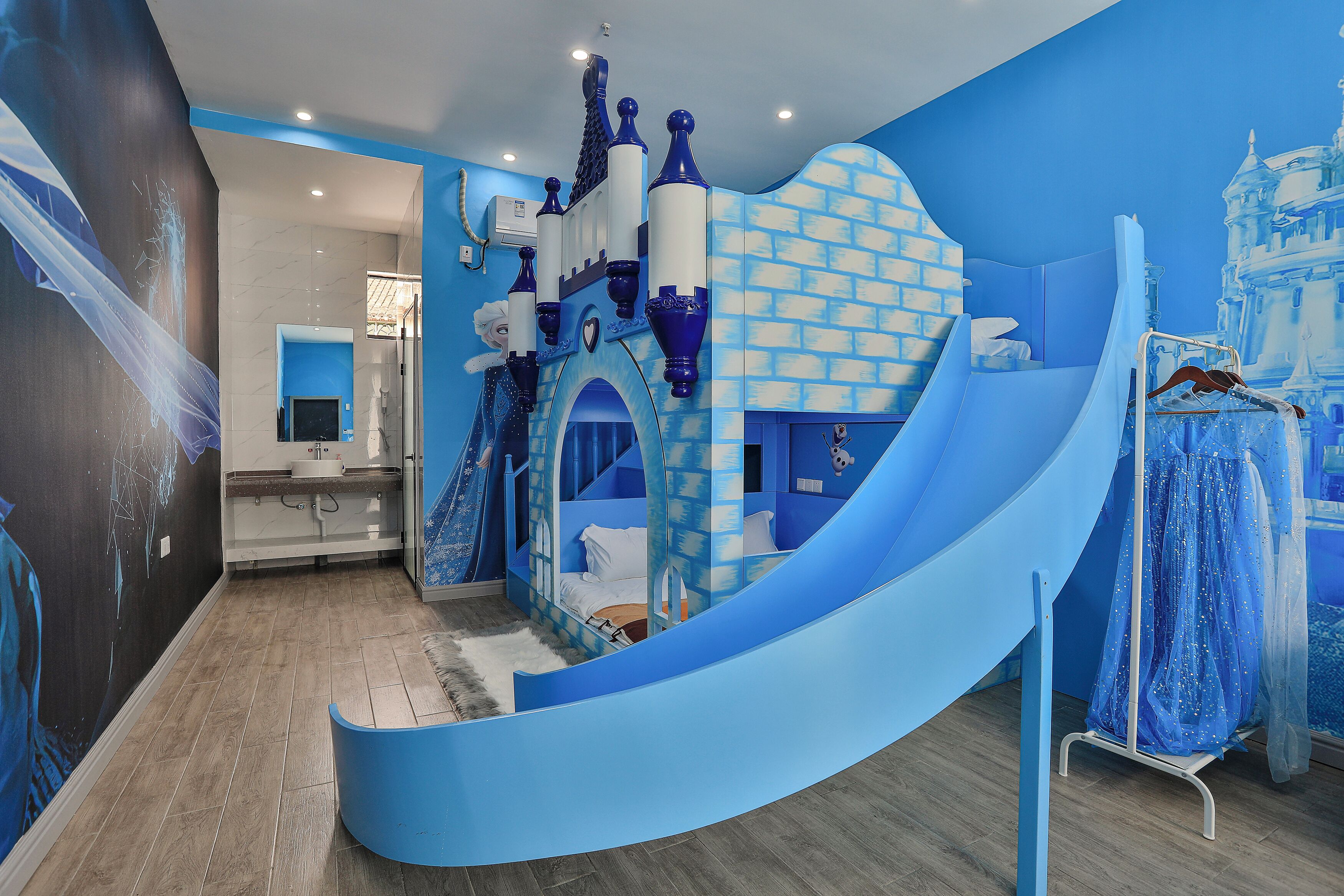 A children's play area with a castle-themed slide and play structures.