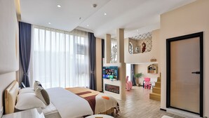 A modern hotel room with a large bed, a small table, and a TV mounted on the wall. - Chuxin Moshe Hotel (Shanghai)