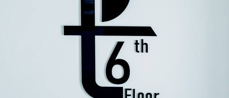 A logo with a stylized 't' and '6th Floor' text, featuring an owl silhouette.