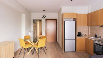 Large 1BR Apartment (65 sqm) with Balcony | Living area | 12-inch Smart TV with cable channels
