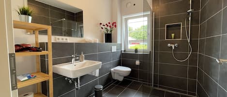 Shower, hair dryer, towels, soap