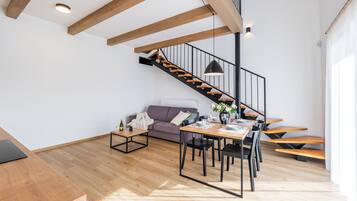 Signature Apartment, Patio, Courtyard View | Living area | Flat-screen TV