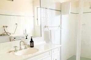 Shower, hair dryer, towels, soap