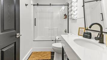 Shower, hair dryer, towels, shampoo
