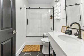 Shower, hair dryer, towels, shampoo