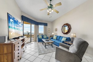Signature Condo, 2 Bedrooms, Balcony, Beach View | Living room | 65-inch Smart TV with cable channels