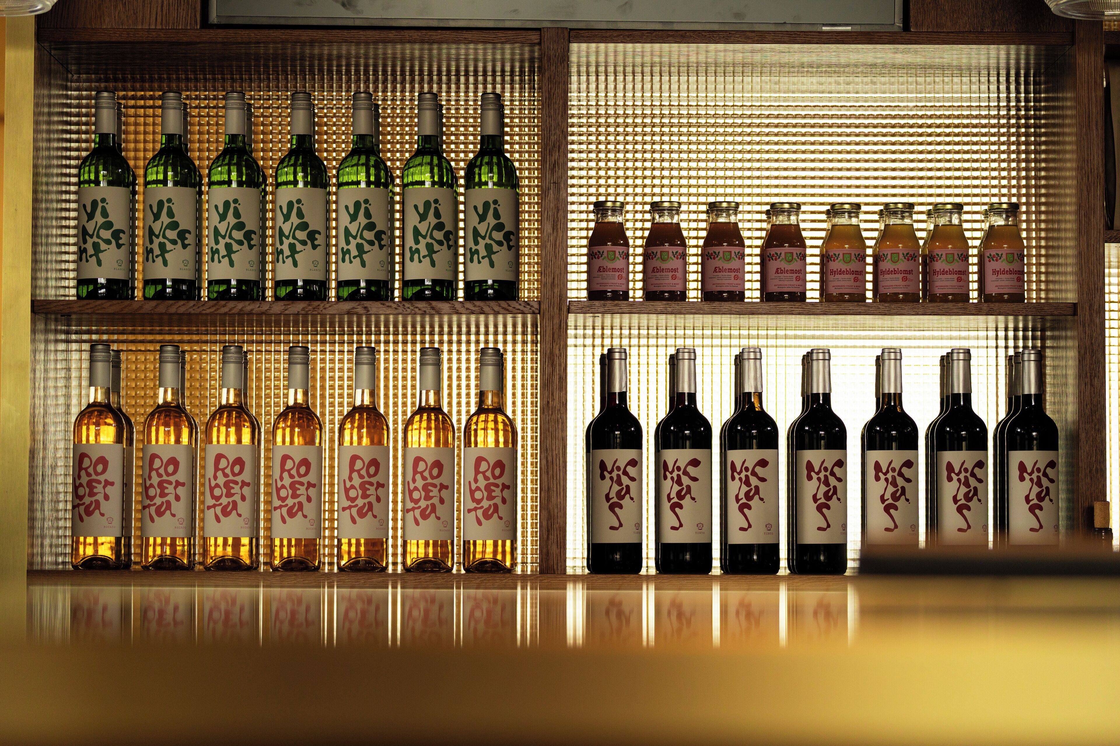 A wine rack with various bottles of wine.