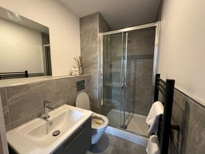 Shower, hair dryer, towels, soap