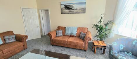 Apartamento família, 2 quartos, para não fumantes, cozinha | 2 quartos, cortinas blackout, ferros/tábuas de passar roupa