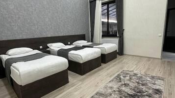 Triple Room | Bathroom | Shower, hair dryer, slippers, towels