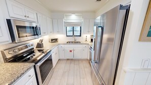 Condo, 2 Bedrooms | Private kitchen | Fridge, oven, coffee/tea maker, toaster
