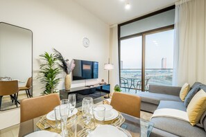 TV - Serene 1BR Apartment in Binghatti Luna, JVC by Deluxe Holiday Homes (Dubai)