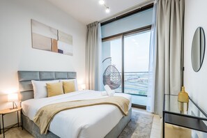 In-room safe, iron/ironing board, free WiFi, bed sheets - Serene 1BR Apartment in Binghatti Luna, JVC by Deluxe Holiday Homes (Dubai)