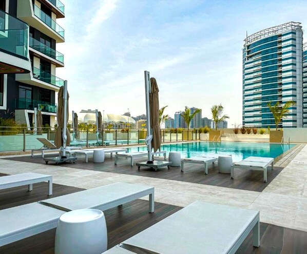 Pool - Serene 1BR Apartment in Binghatti Luna, JVC by Deluxe Holiday Homes (Dubai)