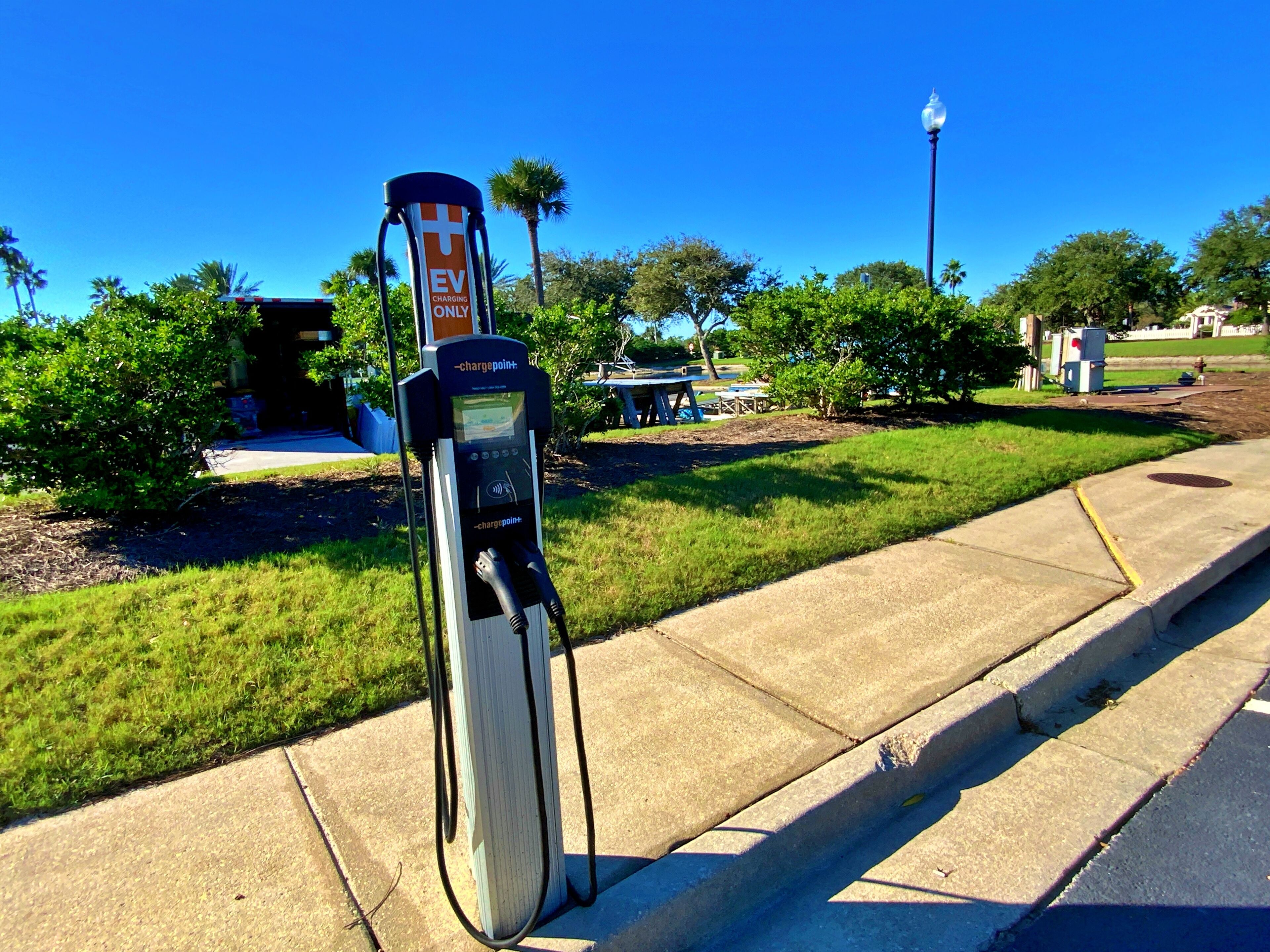 An EV charging station on a sunny day.