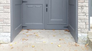 A double door with a number plate '35' and a keypad lock, set in a stone wall. - 29SV-VE Newo Retro (Quebec)