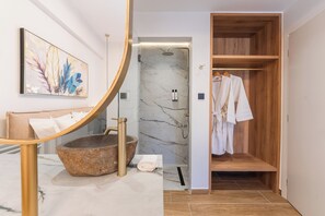 Shower, jetted tub, hair dryer, bathrobes