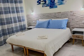 1 bedroom, desk, iron/ironing board, travel cot