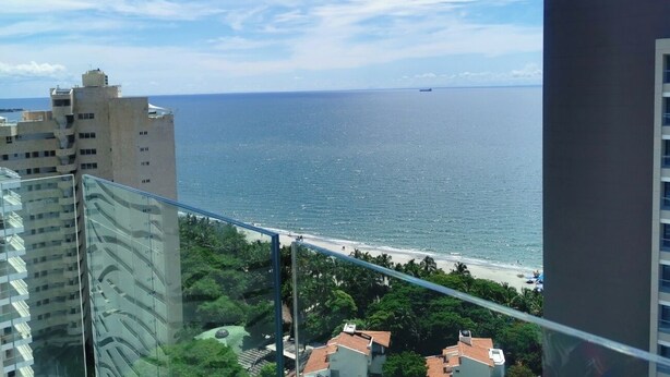 A coastal cityscape with a view of the sea, high-rise buildings, and a beach. - Eden Loft in beautiful Santa Marta Colombia, "The Pearl of the Americas" (Santa Marta)