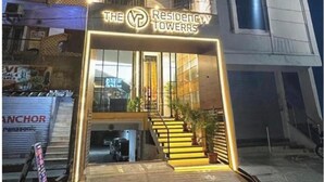A modern building with a sign reading "The Residency Towers." - THE VP RESIDENCY TOWERRS (Thiruthani)