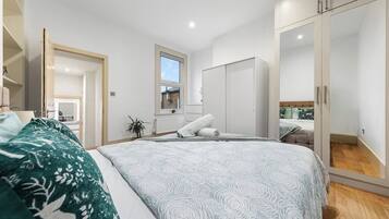 1 bedroom, desk, iron/ironing board, travel crib