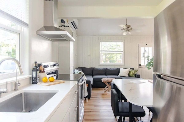 Step into a modern kitchen with spacious countertops, quality appliances, and an inviting layout perfect for cooking and gathering with family or friends.
