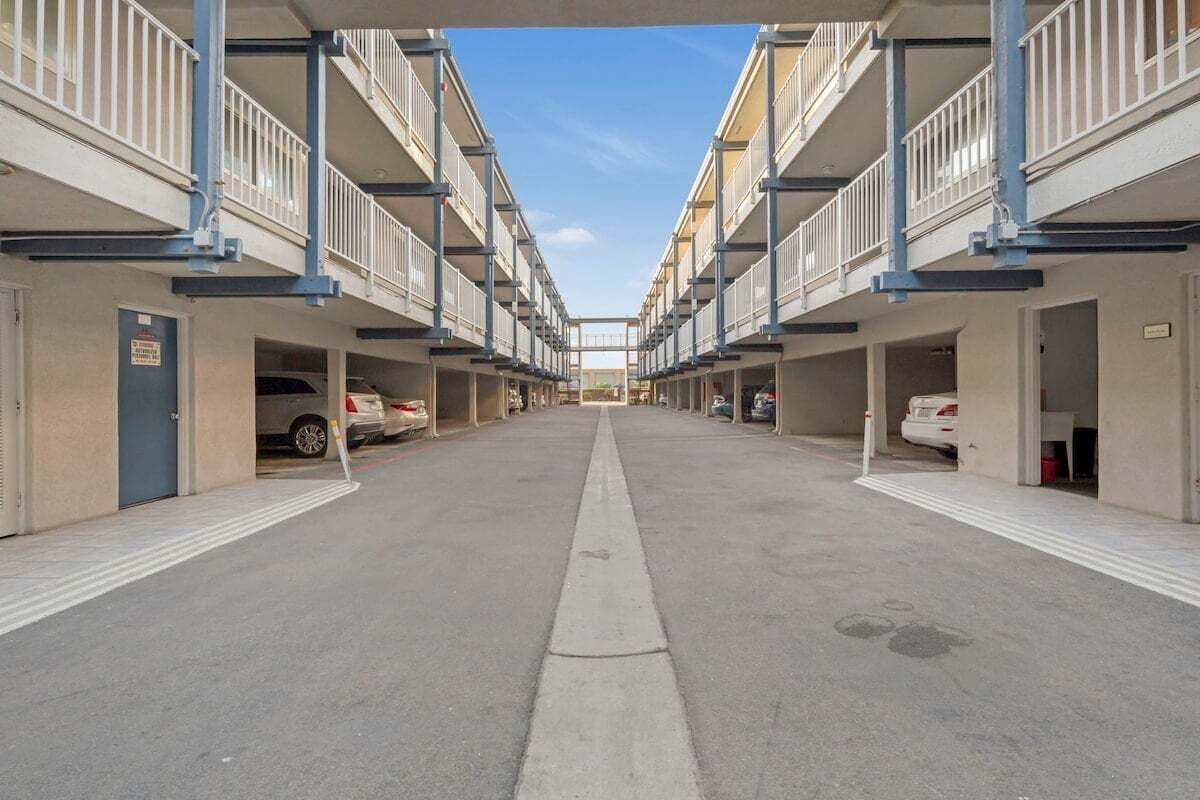 A multi-story parking garage with a central walkway.