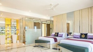 A modern hotel room with two beds, a large mirror, a ceiling fan, and a bathroom with a glass shower. - Hotel Mousai - 2 bedroom (Cancún)