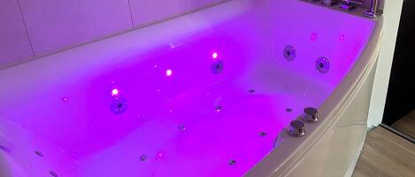 Jetted bath, hair dryer, towels, soap