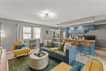Living room with plush couch and beverage cart