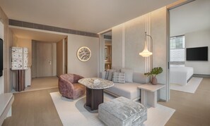 King KROMO Suite | Living area | 55-inch flat-screen TV with satellite channels