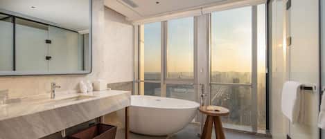 Premium Room, 1 King Bed | Bathroom | Rainfall showerhead, towels