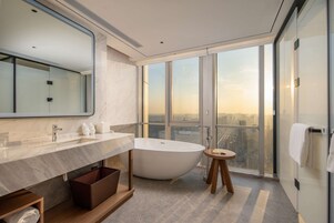 Premium Room, 1 King Bed | Bathroom | Rainfall showerhead, towels