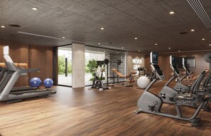 A modern gym with treadmills, elliptical machines, and exercise balls.