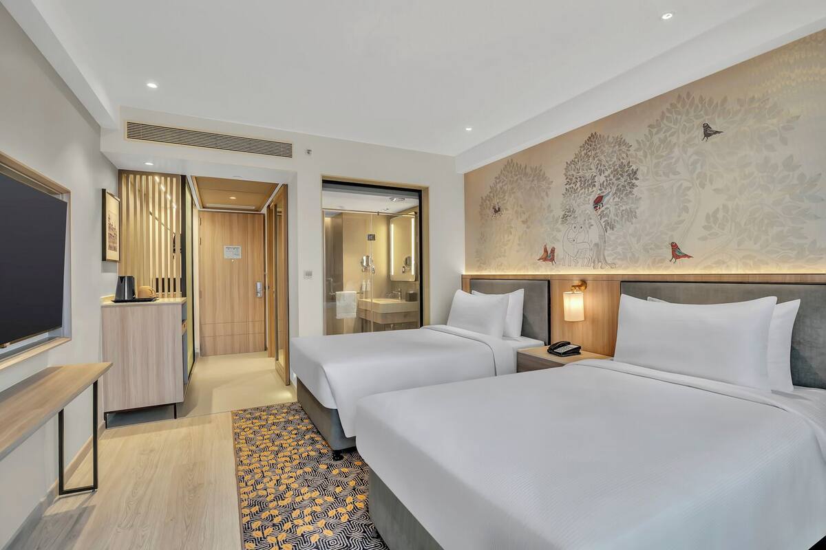 Premium bedding, down duvets, memory-foam beds, in-room safe