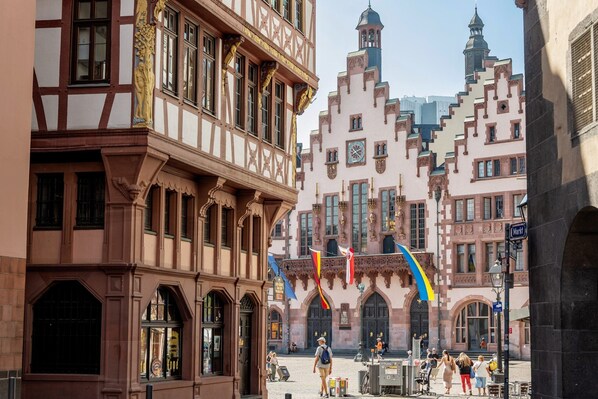 A historic building with ornate facades and a central courtyard.