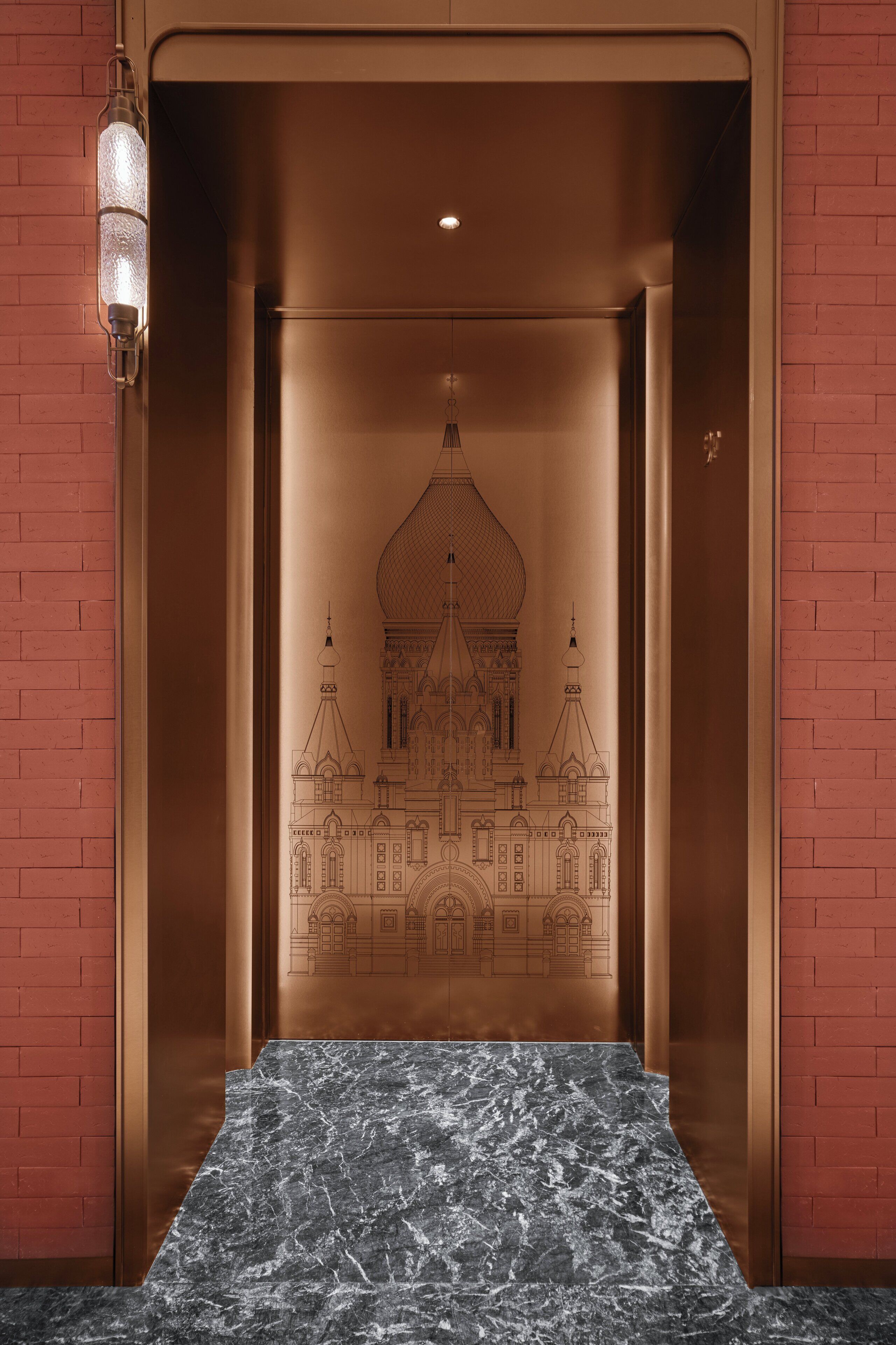 An elevator with a marble floor and a wall mural of a building.