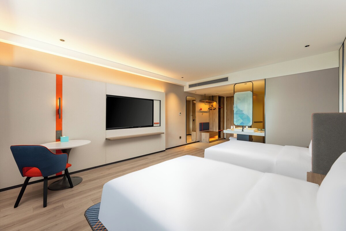 Down comforters, desk, blackout drapes, soundproofing