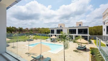Relax by the pool surrounded by lush gardens and take in the breathtaking views of the surrounding landscape.