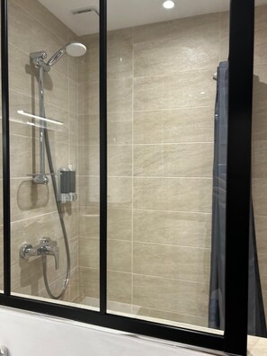 Shower, hair dryer, towels, soap