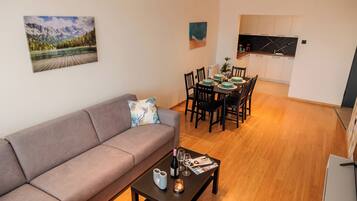 Deluxe Apartment, 2 Bedrooms | Living area | 42-inch Smart TV with cable channels